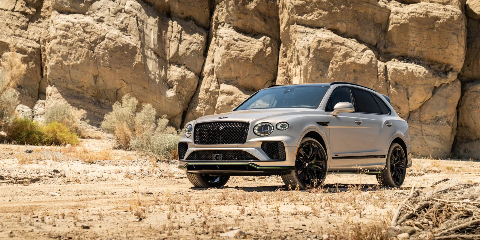 Bentley Bentayga Speed beside desert cliffs near Palm Springs
