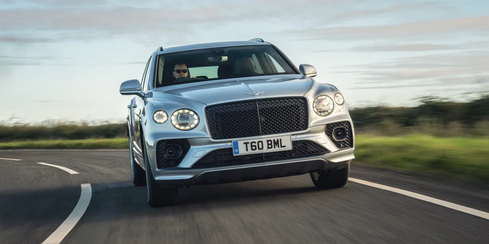 Bentley Bentayga V8 driving on a country road